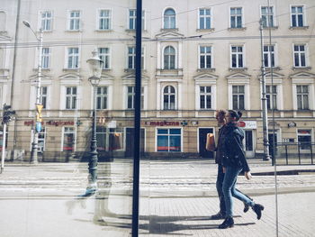 Woman walking on city street