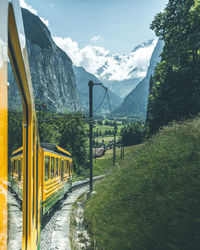 Train against mountains