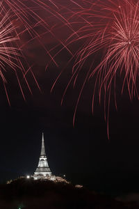 Low angle view of firework display at night