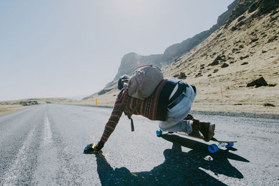 Man skateboarding on highway