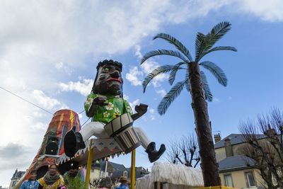 Low angle view of statue against sky