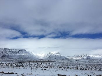 Scenic view of snowcapped mountains against sky