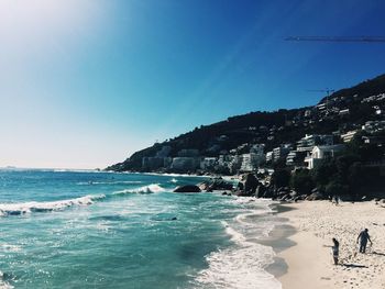 Scenic view of sea against sky on sunny day