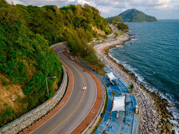 High angle view of road by sea against sky