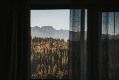Scenic view of mountains seen through window