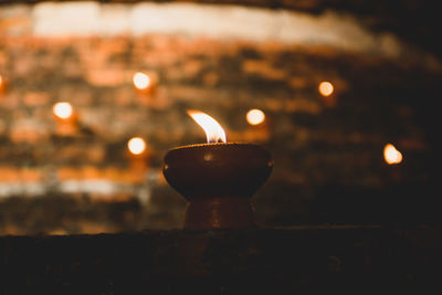 Close-up of illuminated lamp against blurred background