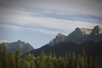 Scenic view of mountains against cloudy sky