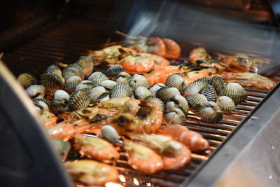 High angle view of meat on barbecue