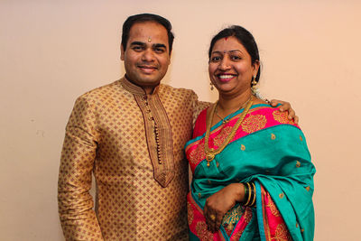 Portrait of happy indian married couple in indian traditional clothes 