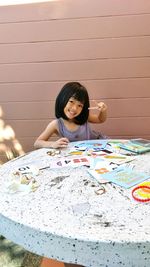 Portrait of a girl sitting on table