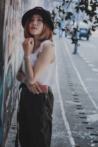 Portrait of woman standing in city