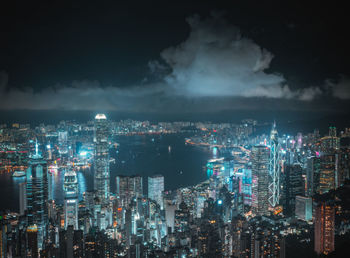 High angle view of illuminated cityscape against sky at night