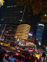 Illuminated modern buildings in city at night