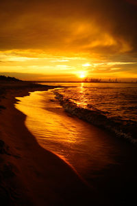 Scenic view of sea against romantic sky at sunset