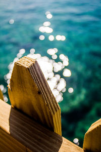 Close-up of wood against sea