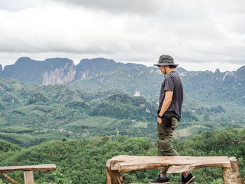 Solo traveller enjoying beautiful nature of hills and during rainy season