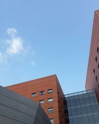 Low angle view of building against blue sky