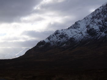 Scenic view of mountains against sky during winter