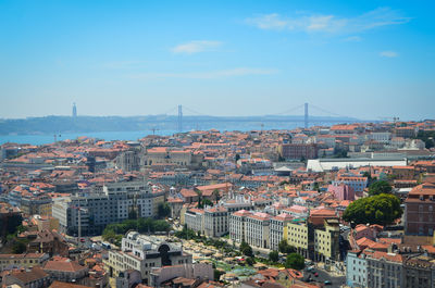 High angle view of cityscape against april 25th bridge over river