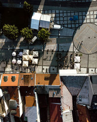 City square with rooftops, cafe and parasols