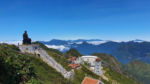 Panoramic view of buildings against blue sky