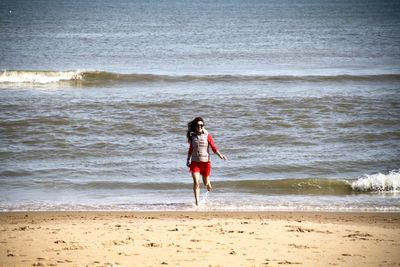 Woman standing on beach