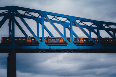 Low angle view of railway bridge against sky