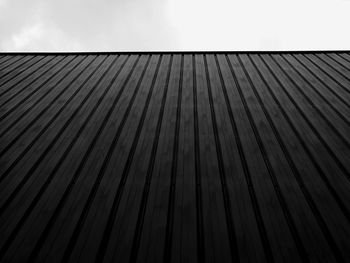 Close-up of metal structure in factory against sky