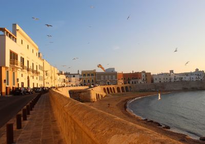 View of buildings against sky during sunset