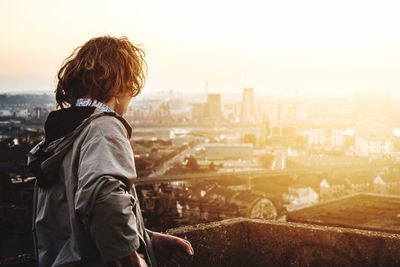 Woman looking at cityscape