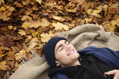 Smiling man lying on back