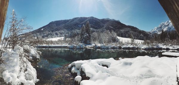 Calm lake along snowed landscape