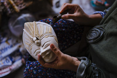 Midsection of woman holding hands