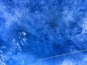 Low angle view of vapor trails in sky