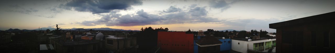 Panoramic view of houses against sky