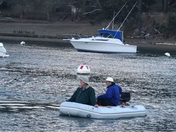 People on boat in sea