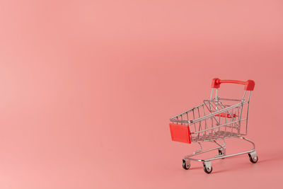Close-up of crane against red background