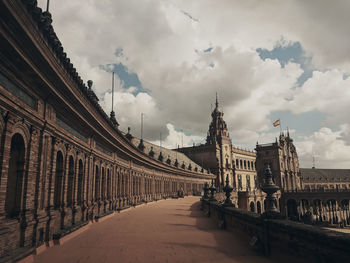 Panoramic view of historic building against cloudy sky