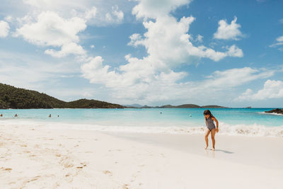 Cruise destination with kids girl plays in the waters of the usvi