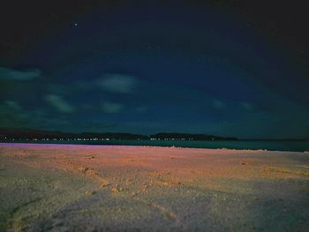 Scenic view of sea against sky at night