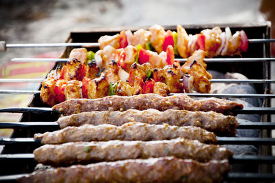 Close-up of kebabs on barbecue grill