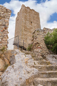 Low angle view of old ruin against sky