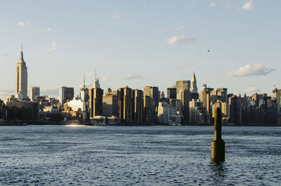 Modern buildings in city against sky