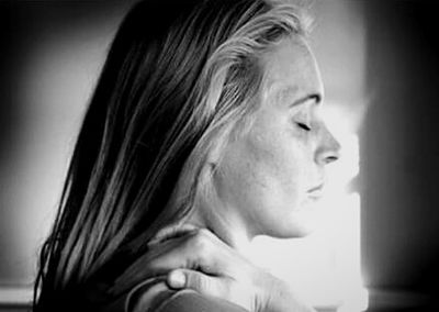 Close-up of young woman looking away