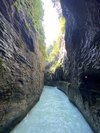 Scenic view of waterfall amidst rocks