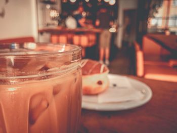 Close-up of drink in glass jar on table