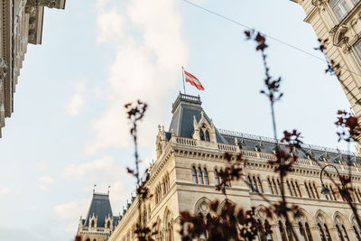 Low angle view of building against cloudy sky