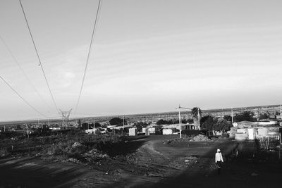 View of city by sea against sky