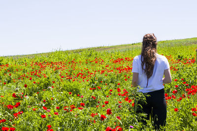 Full length of person standing on field against sky