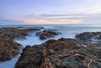 Scenic view of sea at sunset